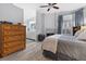 Spacious bedroom with bathroom access, a fireplace, and stylish, neutral furnishings at 8433 Honeywood Cir, Las Vegas, NV 89128