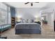 Bright bedroom featuring a large bed, bay windows with seating, and neutral décor at 8433 Honeywood Cir, Las Vegas, NV 89128