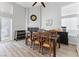 Cozy dining room featuring a large table, fireplace and bright light at 8433 Honeywood Cir, Las Vegas, NV 89128