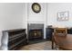 Close-up of the dining room fireplace, and vintage decor at 8433 Honeywood Cir, Las Vegas, NV 89128