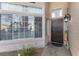 Inviting front entrance with a decorative door, sidelight window, and charming decorations at 8433 Honeywood Cir, Las Vegas, NV 89128