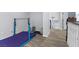 Hallway features wood flooring and a gymnastics bar with padding at 8433 Honeywood Cir, Las Vegas, NV 89128