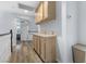Hallway features wood flooring and built-in storage cabinets at 8433 Honeywood Cir, Las Vegas, NV 89128