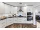 Beautiful kitchen with white cabinets, granite countertops, stainless steel appliances, and modern fixtures at 8433 Honeywood Cir, Las Vegas, NV 89128