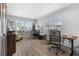 Spacious home office features wood floors, multiple desks, and large windows for natural lighting at 8433 Honeywood Cir, Las Vegas, NV 89128