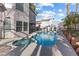 A refreshing pool and spa combination with a lounge area, perfect for outdoor relaxation and entertainment at 8433 Honeywood Cir, Las Vegas, NV 89128