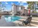 Backyard showcases a private pool and a patio area at 8433 Honeywood Cir, Las Vegas, NV 89128