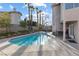 Backyard showcasing a private pool and desert landscaping at 8433 Honeywood Cir, Las Vegas, NV 89128