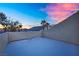 Rooftop balcony featuring a view of the neighboring palm trees, blue skies, and clouds at 8512 Porch Rocker St, Las Vegas, NV 89143