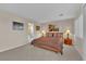 A spacious main bedroom features a king bed, ensuite bathroom, and dual bedside tables at 8512 Porch Rocker St, Las Vegas, NV 89143