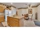 Open kitchen with a central island and adjacent dining area at 8512 Porch Rocker St, Las Vegas, NV 89143