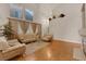 Spacious living room featuring hardwood floors and large windows at 8512 Porch Rocker St, Las Vegas, NV 89143