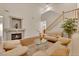 Bright living room with fireplace, hardwood floors, and staircase access at 8512 Porch Rocker St, Las Vegas, NV 89143