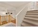 A carpeted staircase blends warmth and style, inviting access to the upper level at 8512 Porch Rocker St, Las Vegas, NV 89143