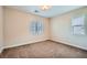 Bright bedroom with carpet, white trim, and natural light from a window at 857 White Sparrow St, Henderson, NV 89052