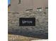 Close up shot of an 'Upton' community sign made of stone at 9059 Rivington Ave, Las Vegas, NV 89148