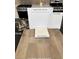 Kitchen design choices showcase white Elkins cabinets and luxury vinyl plank flooring at 9059 Rivington Ave, Las Vegas, NV 89148