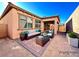 Inviting backyard patio featuring brick pavers and stylish outdoor furniture at 907 Gallery Course Dr, Las Vegas, NV 89148