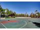 Outdoor community basketball court, featuring lush landscaping and clear blue skies at 907 Gallery Course Dr, Las Vegas, NV 89148