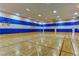 Indoor community basketball court with hardwood floors and bright lighting at 907 Gallery Course Dr, Las Vegas, NV 89148