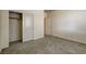 Neutral bedroom featuring carpet floors and a large closet with sliding doors at 907 Gallery Course Dr, Las Vegas, NV 89148