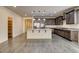 Bright, open kitchen features stainless appliances, granite countertops and a large kitchen island at 907 Gallery Course Dr, Las Vegas, NV 89148