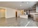 Open kitchen with an expansive island, stainless appliances, and convenient pantry access at 907 Gallery Course Dr, Las Vegas, NV 89148