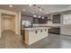 Bright kitchen features an island, stainless steel appliances, and granite countertops at 907 Gallery Course Dr, Las Vegas, NV 89148