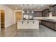 Bright kitchen featuring an island with bar seating, stainless appliances, and granite countertops at 907 Gallery Course Dr, Las Vegas, NV 89148