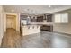 Open kitchen with stainless steel appliances, granite countertops, and an island with pendant lighting at 907 Gallery Course Dr, Las Vegas, NV 89148
