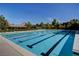Long community pool with swimming lanes and well-maintained surroundings, promoting an active lifestyle at 907 Gallery Course Dr, Las Vegas, NV 89148