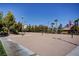 Community sand volleyball court with trees and nearby water park at 907 Gallery Course Dr, Las Vegas, NV 89148