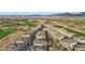 Panoramic view of a multi-Gathering community beside a well-maintained golf course with desert landscape, mountains in the distance at 9144 Las Manaitas Ave # 201, Las Vegas, NV 89144