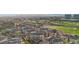 Beautiful aerial view of a multi-Gathering community with a golf course in the background and distant city views at 9144 Las Manaitas Ave # 201, Las Vegas, NV 89144