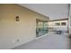 A large covered balcony includes sliding glass doors and outdoor lighting at 9144 Las Manaitas Ave # 201, Las Vegas, NV 89144