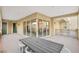 Large covered balcony with outdoor dining area at 9144 Las Manaitas Ave # 201, Las Vegas, NV 89144