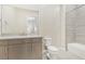 Bright bathroom features a tiled shower over tub and modern vanity at 9144 Las Manaitas Ave # 201, Las Vegas, NV 89144