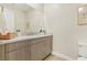 Bathroom featuring modern vanity with storage, stone countertops, and brushed nickel hardware at 9144 Las Manaitas Ave # 201, Las Vegas, NV 89144