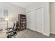 Comfortable bedroom featuring a bookcase, closet, and shuttered window at 9144 Las Manaitas Ave # 201, Las Vegas, NV 89144