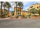 Community building with palm trees and lush landscaping offers relaxation and curb appeal at 9144 Las Manaitas Ave # 201, Las Vegas, NV 89144