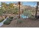 Inviting community pool area with lush landscaping and water features at 9144 Las Manaitas Ave # 201, Las Vegas, NV 89144
