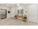 A stylish entryway featuring an elevator, hardwood floors, and tasteful decor at 9144 Las Manaitas Ave # 201, Las Vegas, NV 89144