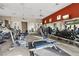 Well-equipped fitness center with modern exercise machines, weights, and multiple televisions at 9144 Las Manaitas Ave # 201, Las Vegas, NV 89144
