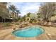 Inviting hot tub with rock features and outdoor seating provides relaxation and tranquility at 9144 Las Manaitas Ave # 201, Las Vegas, NV 89144