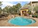 Inviting hot tub with rock features and outdoor seating offers relaxation and tranquility at 9144 Las Manaitas Ave # 201, Las Vegas, NV 89144