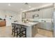 Stylish kitchen with light wood cabinets, a large island, and stainless steel appliances, perfect for entertaining at 9144 Las Manaitas Ave # 201, Las Vegas, NV 89144