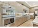 Gourmet kitchen featuring double ovens, a gas cooktop, and ample counter space, ideal for cooking enthusiasts at 9144 Las Manaitas Ave # 201, Las Vegas, NV 89144