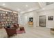 Spacious library with floor-to-ceiling bookshelves, comfortable seating, and elevator access at 9144 Las Manaitas Ave # 201, Las Vegas, NV 89144