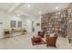 Well-lit library featuring floor-to-ceiling bookshelves, cozy seating, and modern decor at 9144 Las Manaitas Ave # 201, Las Vegas, NV 89144