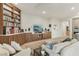 A bright living room with custom built-ins, an entertainment center, and comfortable seating at 9144 Las Manaitas Ave # 201, Las Vegas, NV 89144
